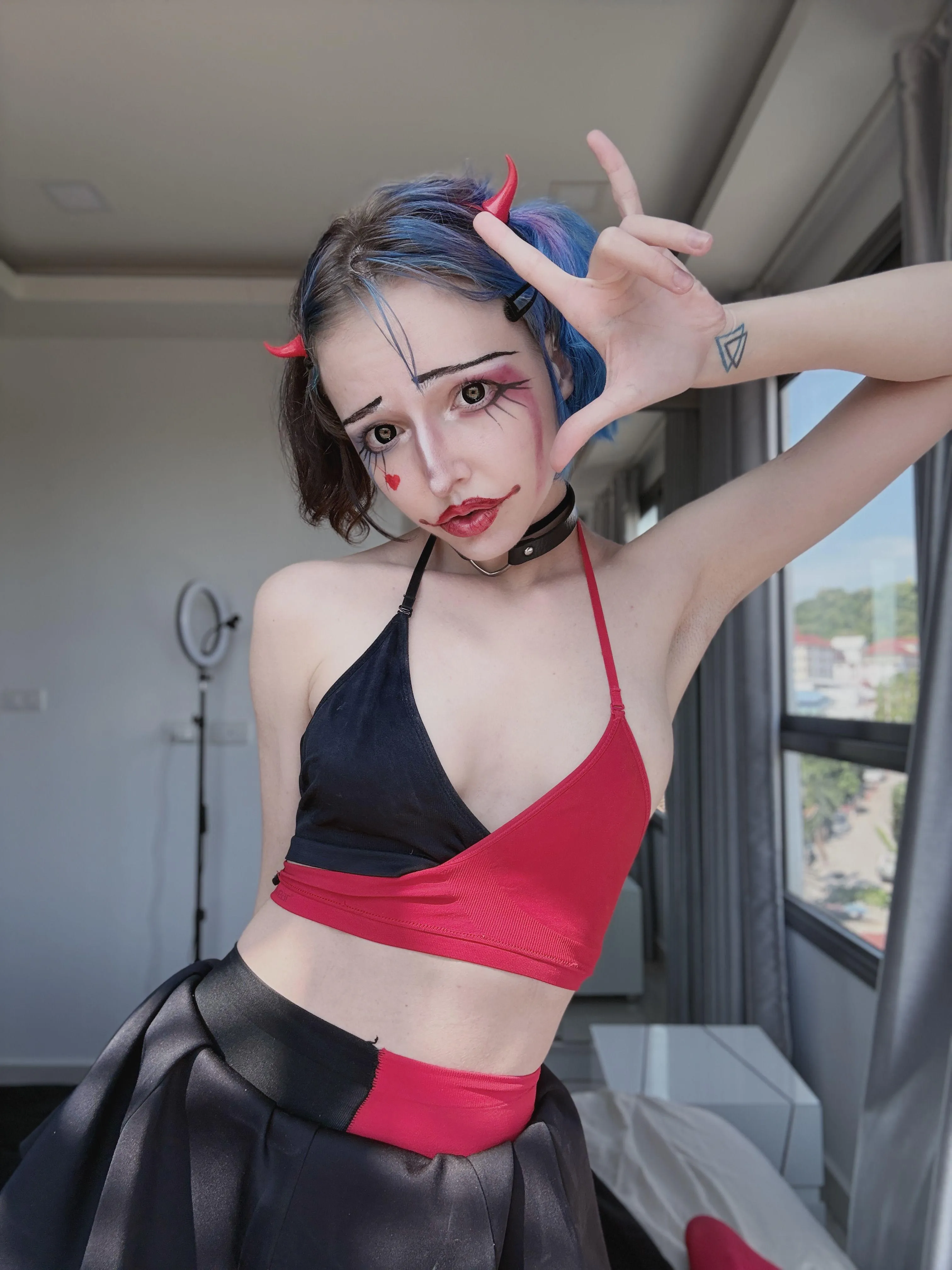 little demonic clown doing all sorts of mischief