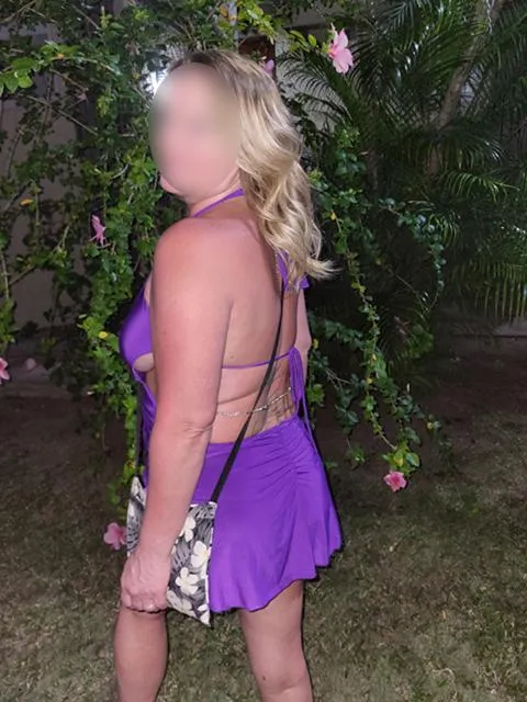Feeling so sexy on the beach for dinner in my slutty purple minidress. Join me and I may suck your cock like I suck the juice from this coconut
