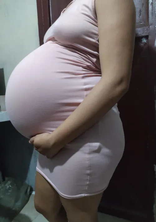 How does this tight dress look on my pregnant belly?