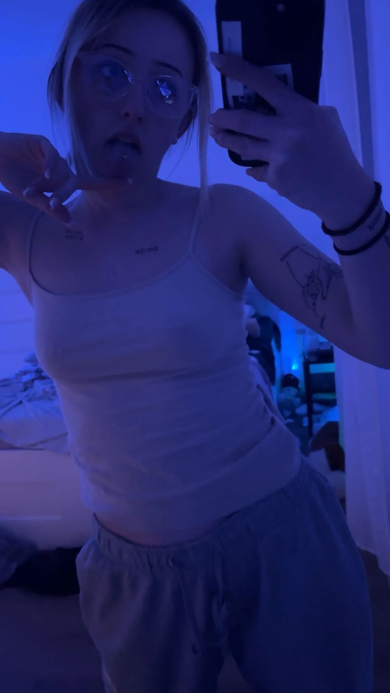 My piercings lurking through my top haha