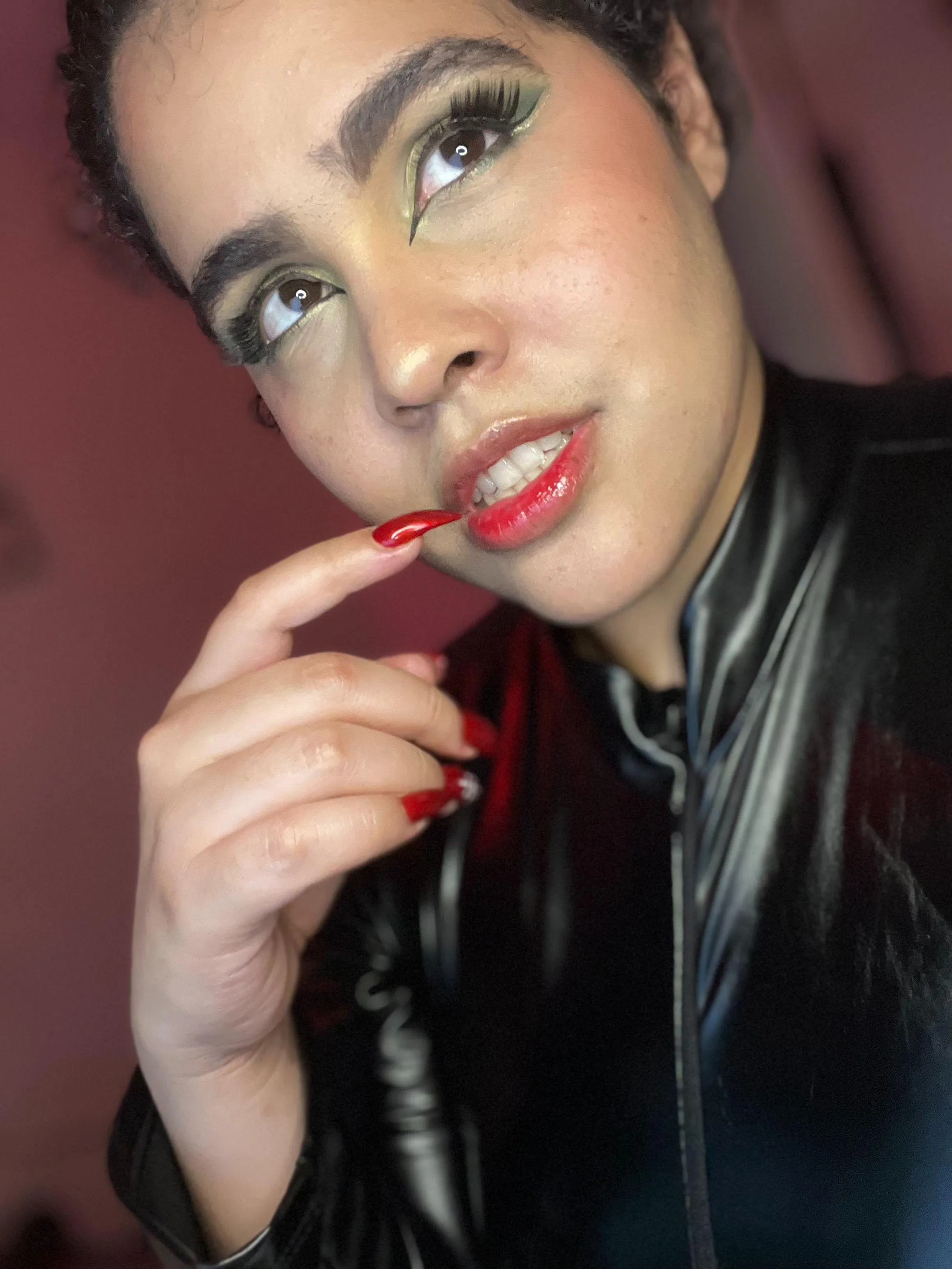 Red nails, the secret weapon to any seductress's arsenal.