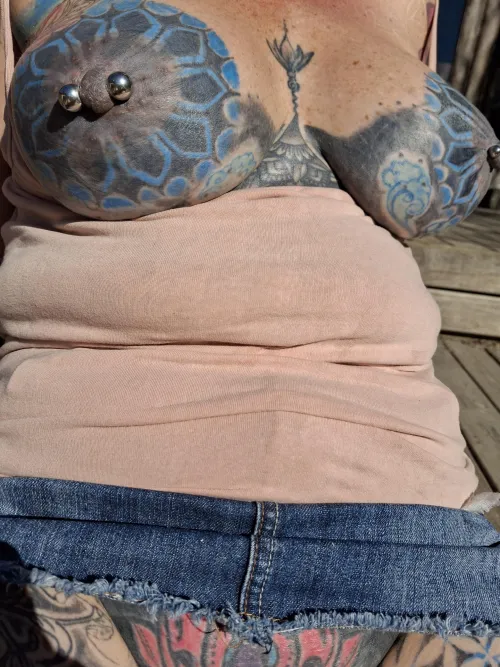 Tattooed nipples getting some sun
