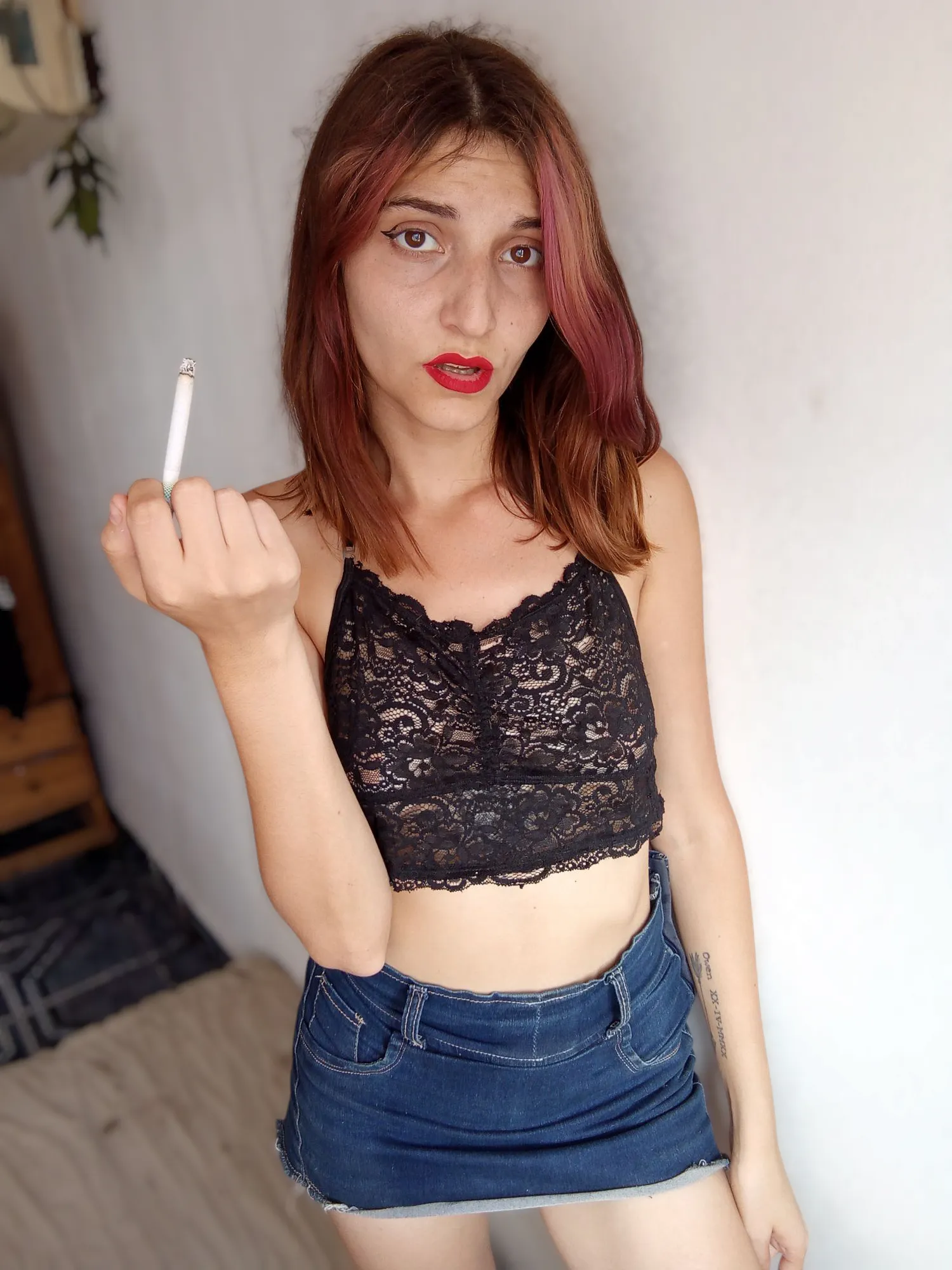 A goddess inhaling and exhaling smoke