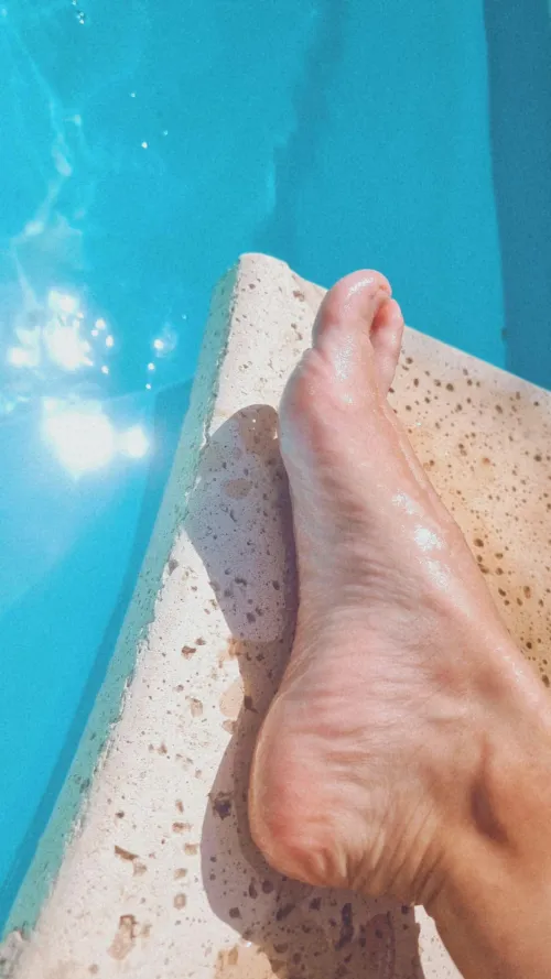 My little one sunbathing in the pool