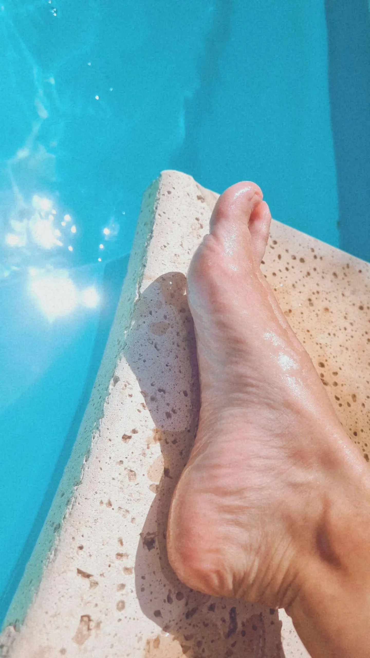 My little one sunbathing in the pool