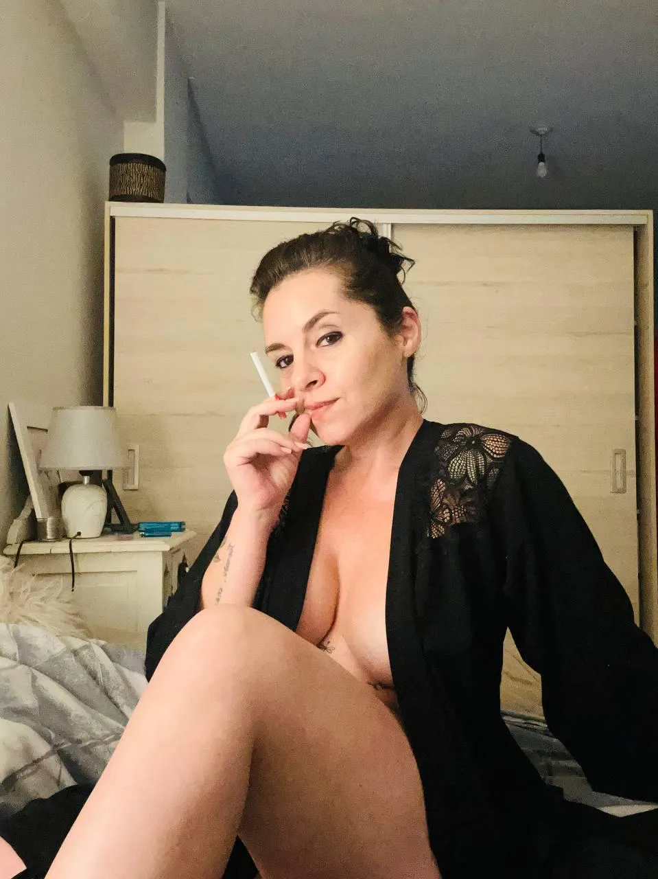 light my cigarette and smoke with me