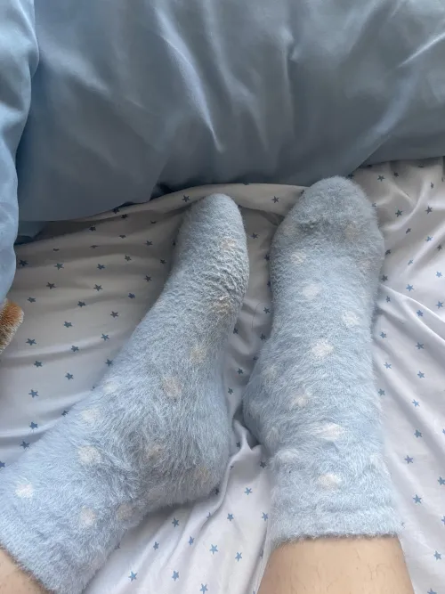 love being cozy in bed with my fuzzy socks