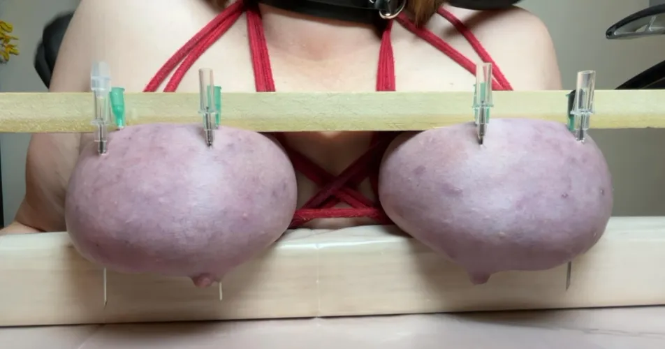 I angled the 2 big needles so they would come out through her nipples