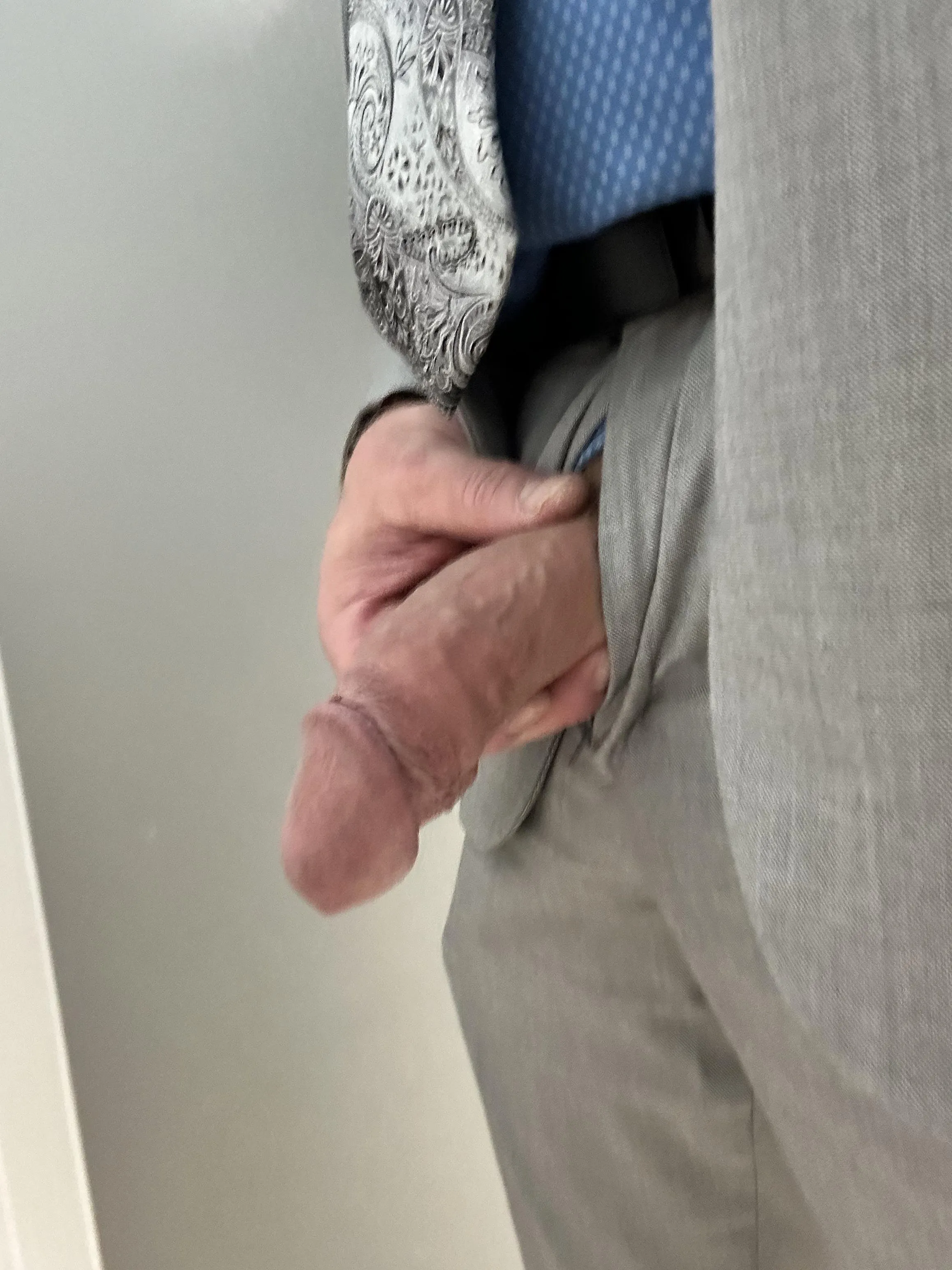 Suit cock at the urinal