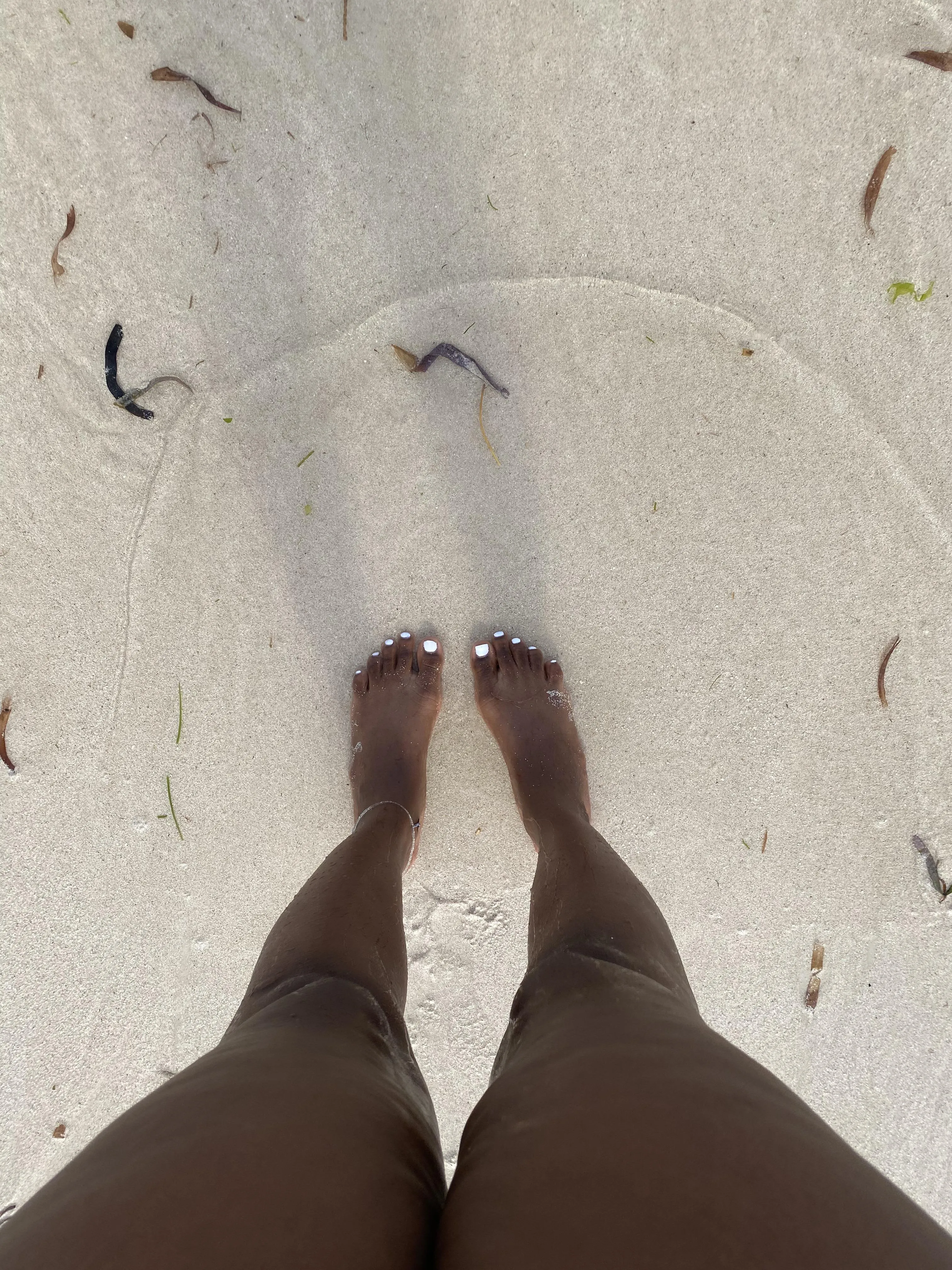 Ebony feet at the beach getting wet
