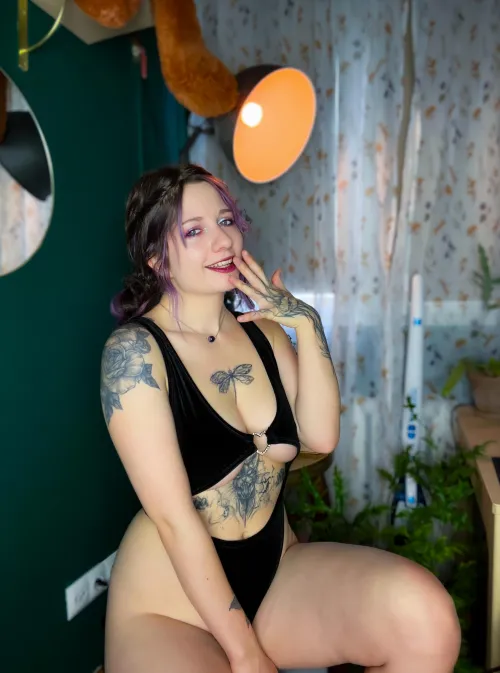 enjoying indoors in a black bodysuit