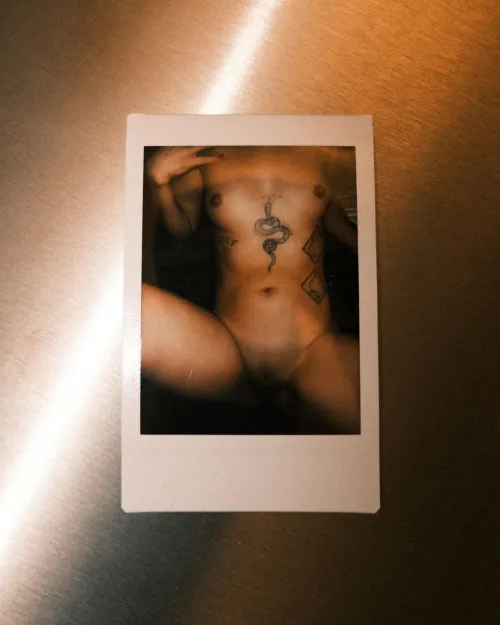 if she has a snake tattoo, you know the sex will be good. polaroid by me, Maison de Gellert