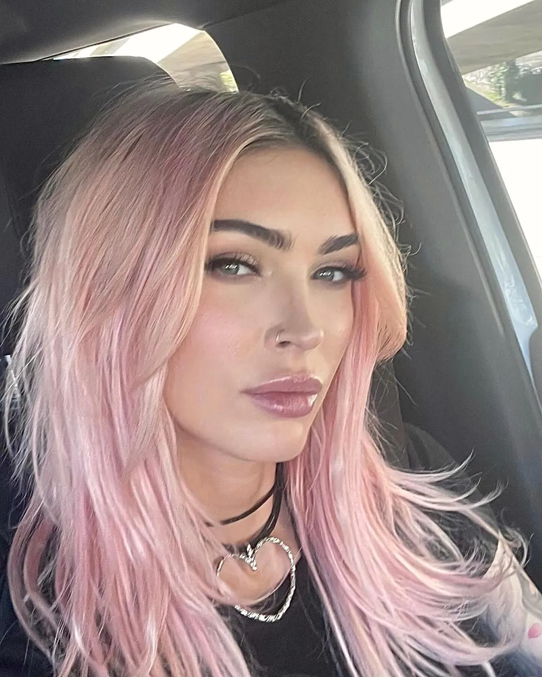 Love all that plastic on Megan Fox’s face