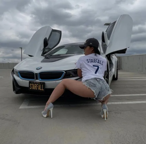 BMW in shorts and high heels