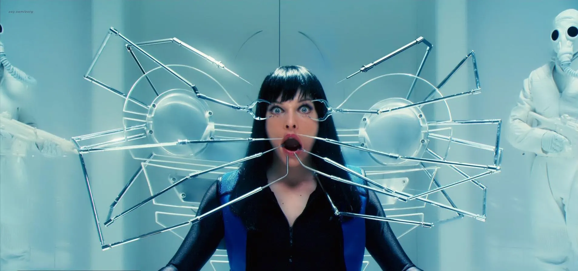 Milla Jovovich mouth and eyes held open by shitty CGI