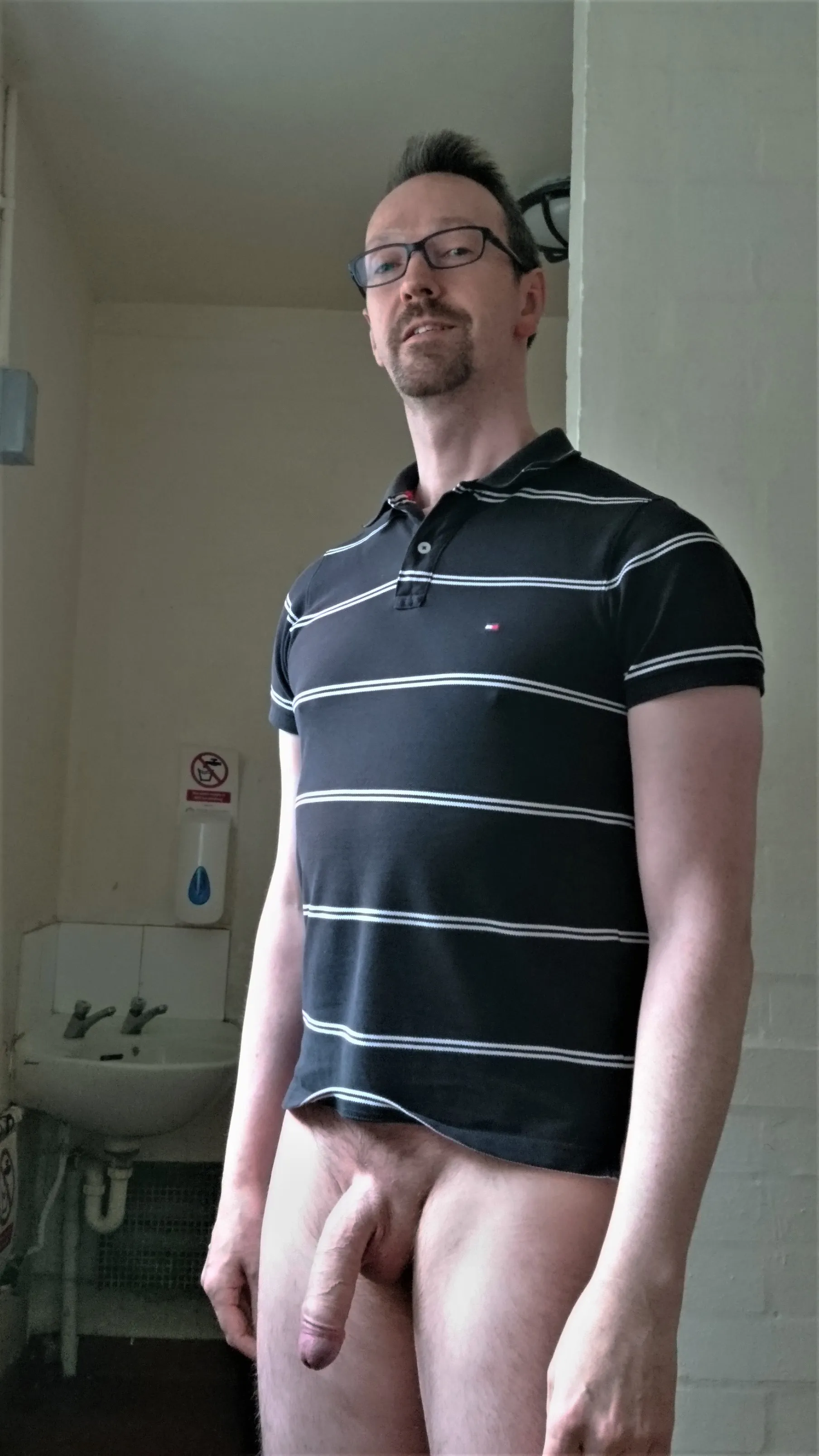 Letting it hang out in a public restroom