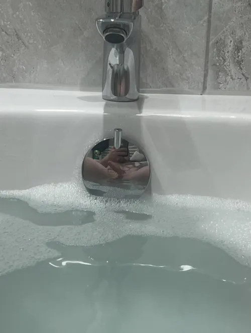 Enjoying a bath, noticed the reflection