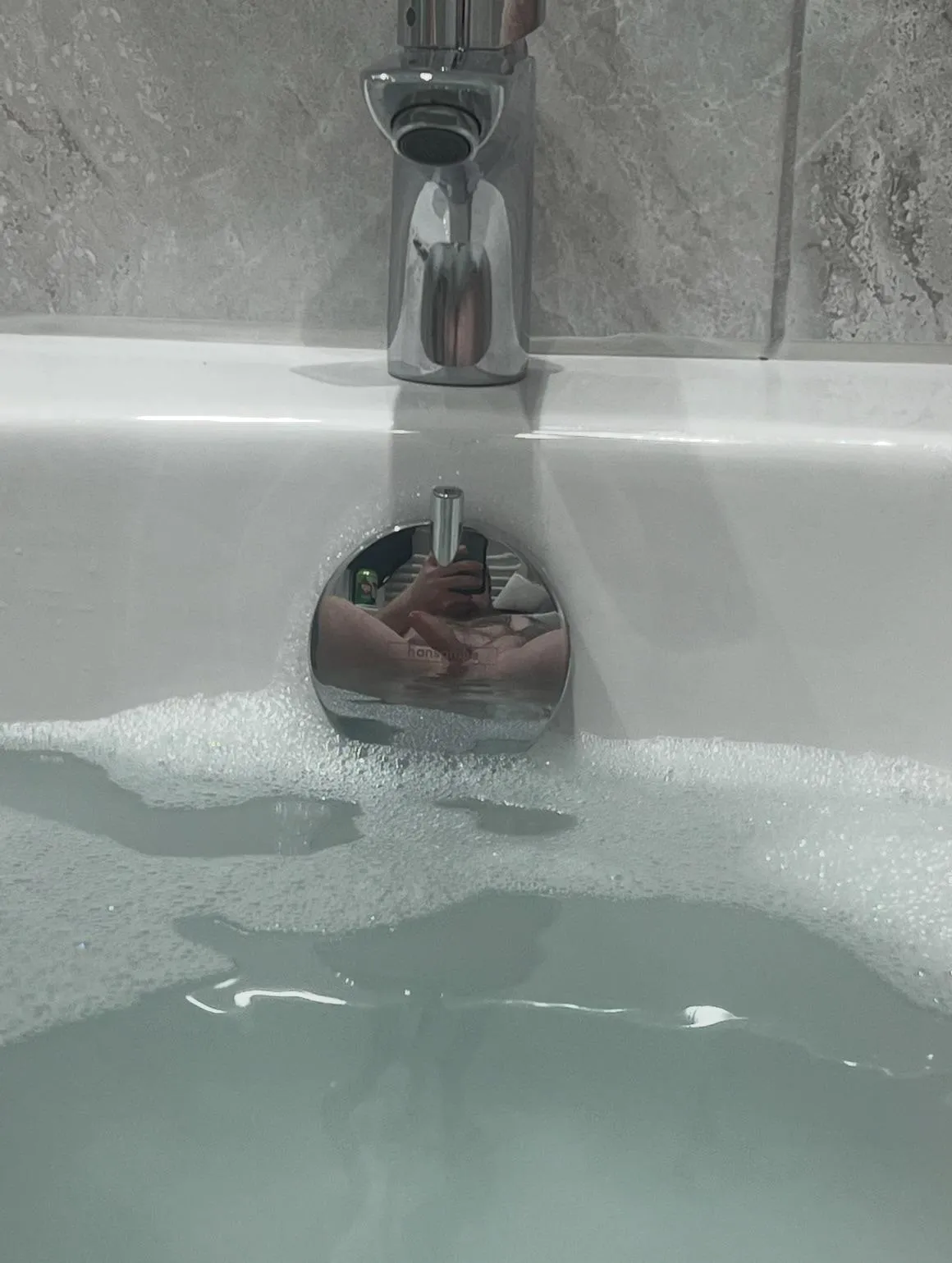Enjoying a bath, noticed the reflection