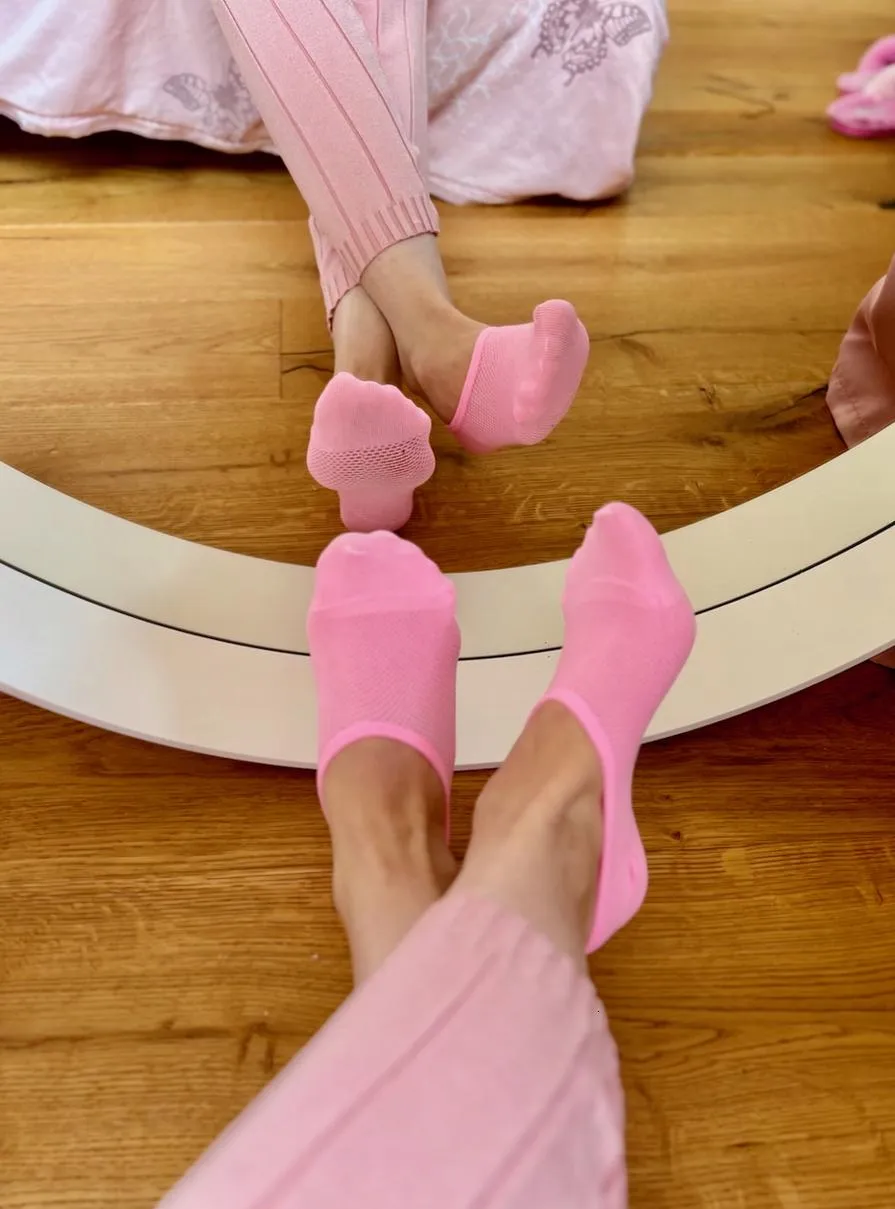 Pink socks reflected in the mirror. Here's a feet selfie for you!