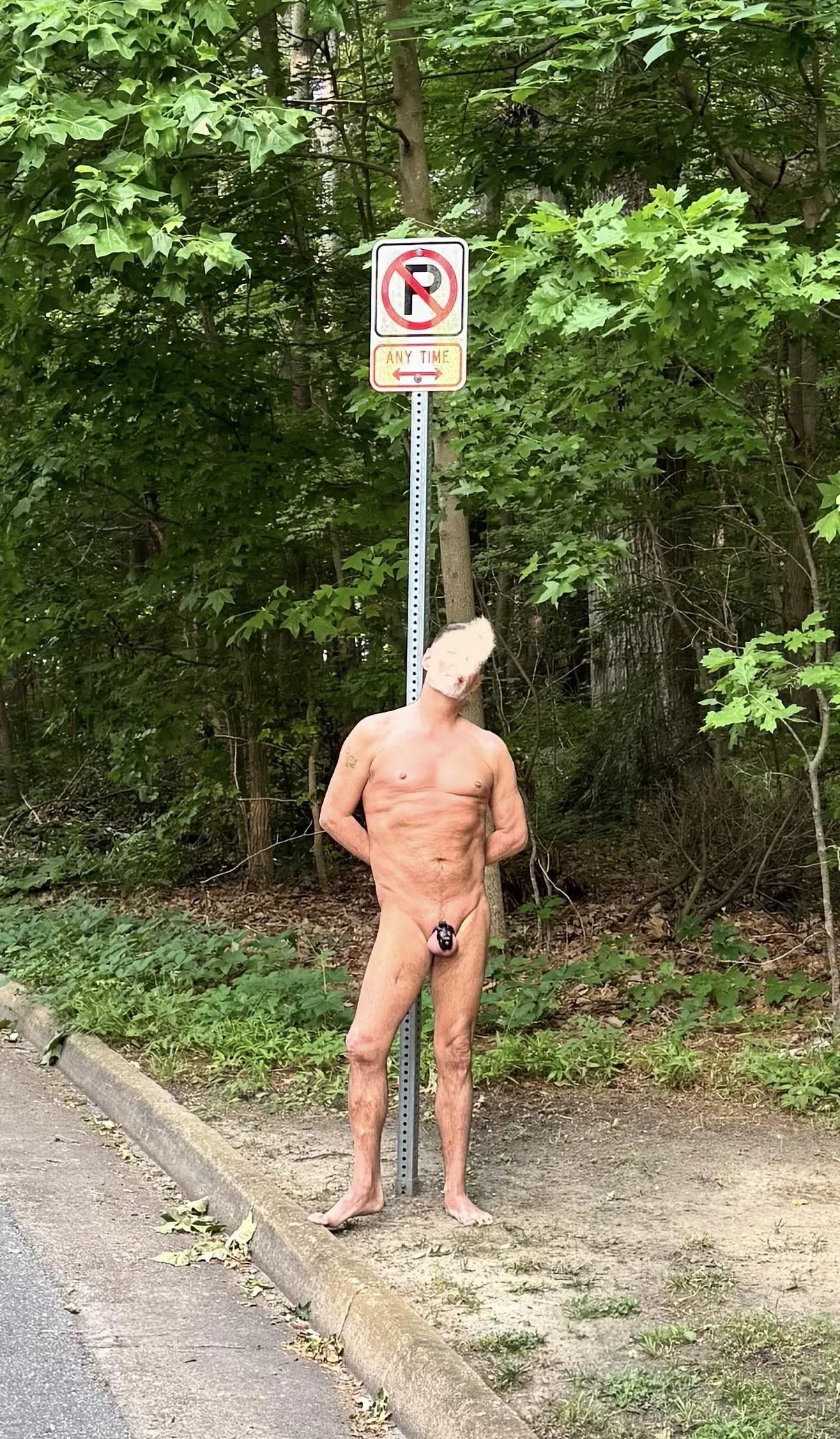 Caged and Tied to the no parking sign… this neighborhood takes parking seriously