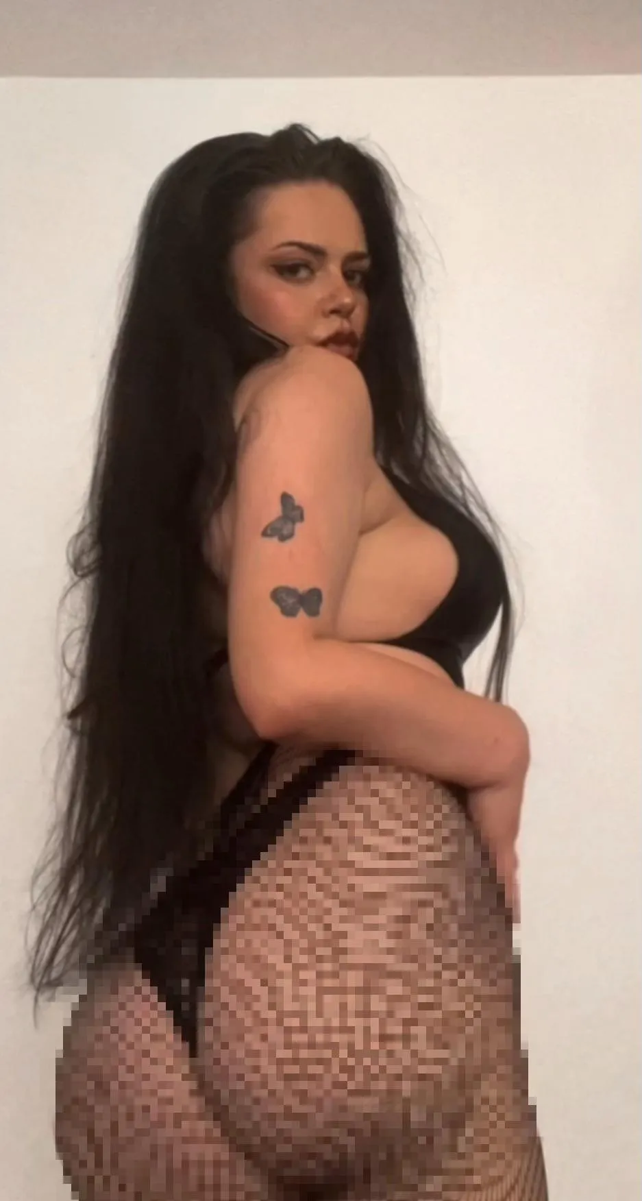 My thick ass is wrapped in fishnets, pixelated just enough to remind you of what you’ll never touch.
