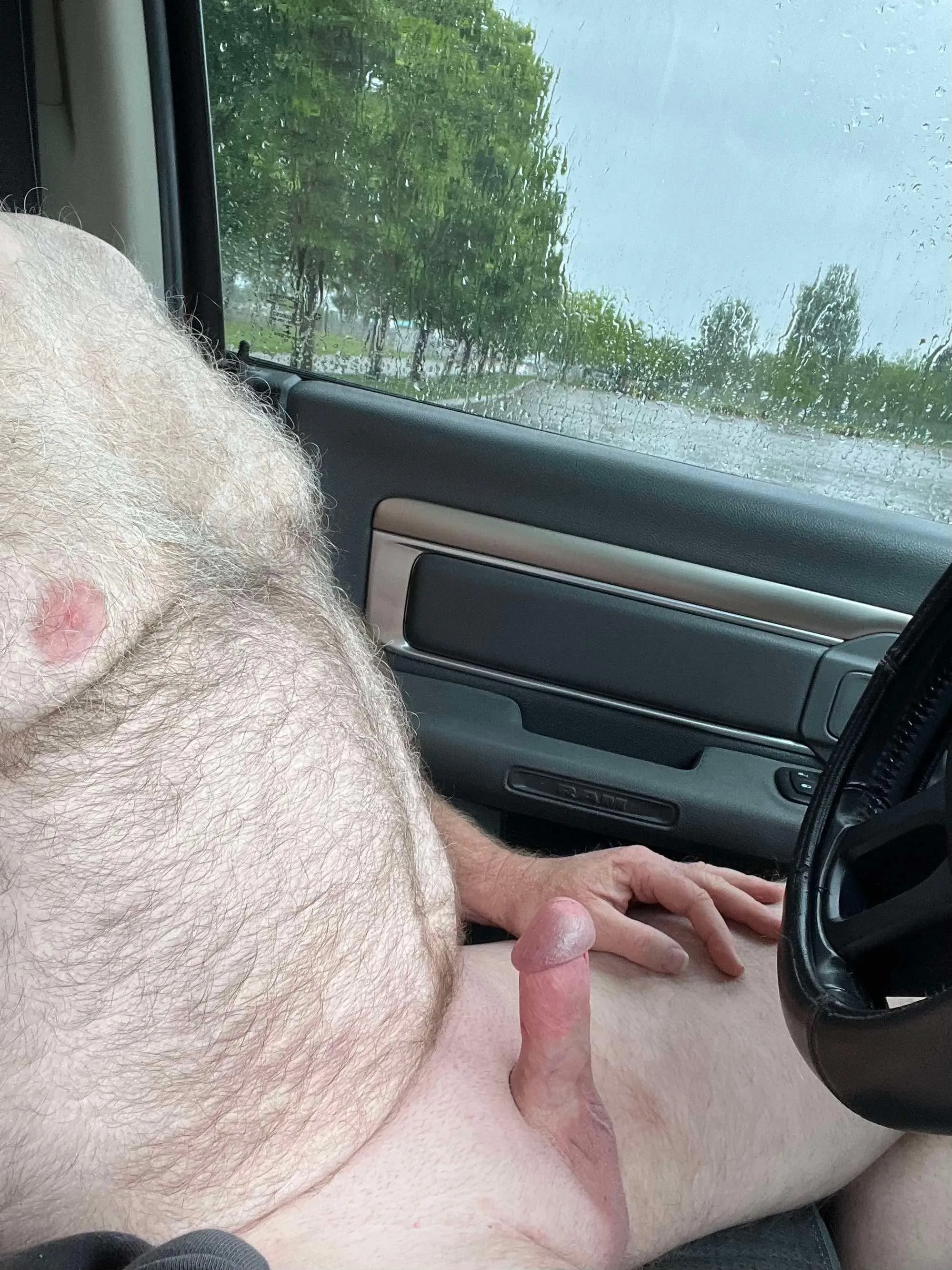 Nude rainy day drive