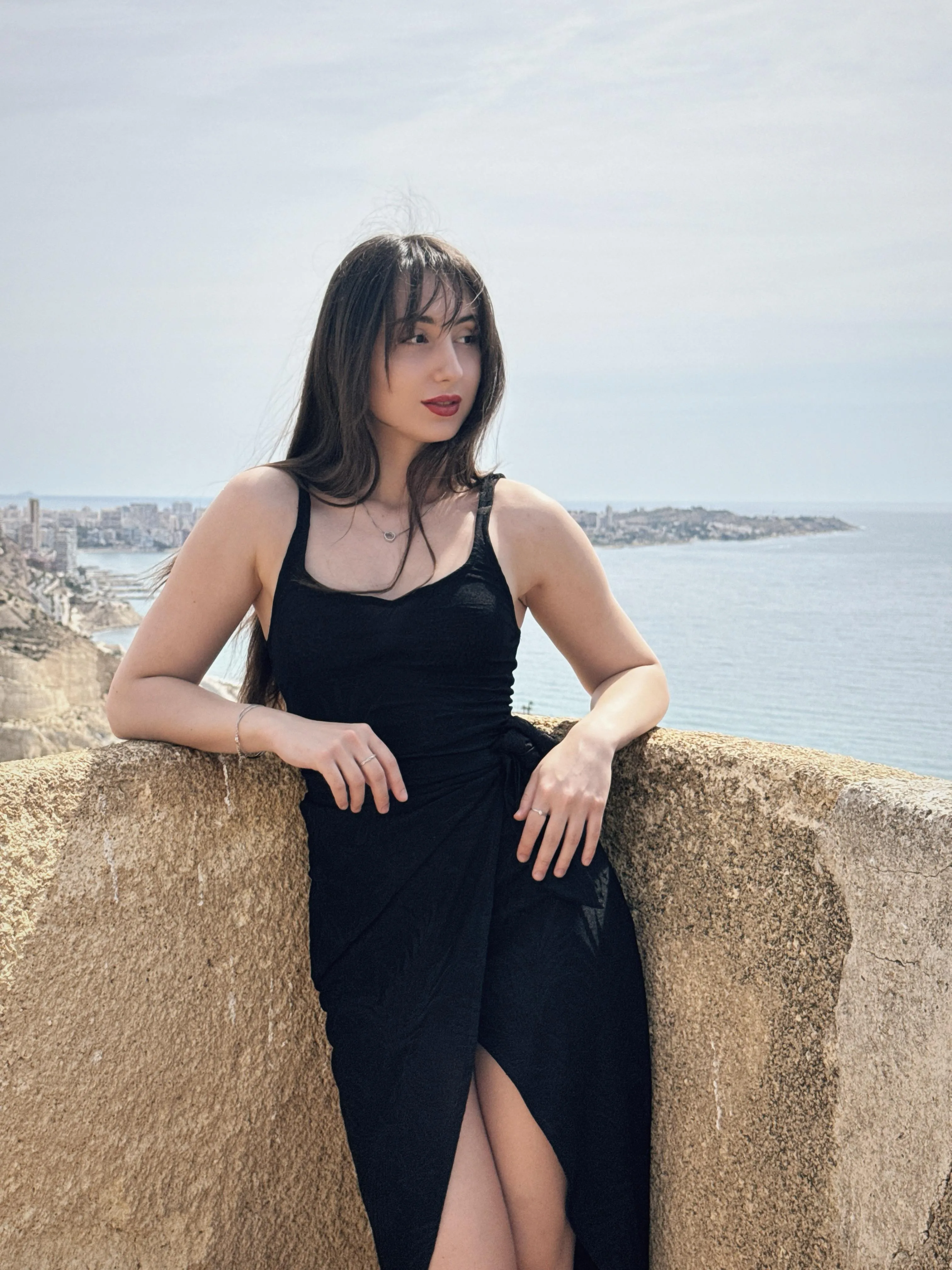 Black dress, red lips, ocean breeze — and not a single thought of mercy
