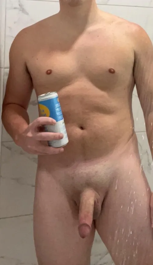 Enjoying a drink in the shower.