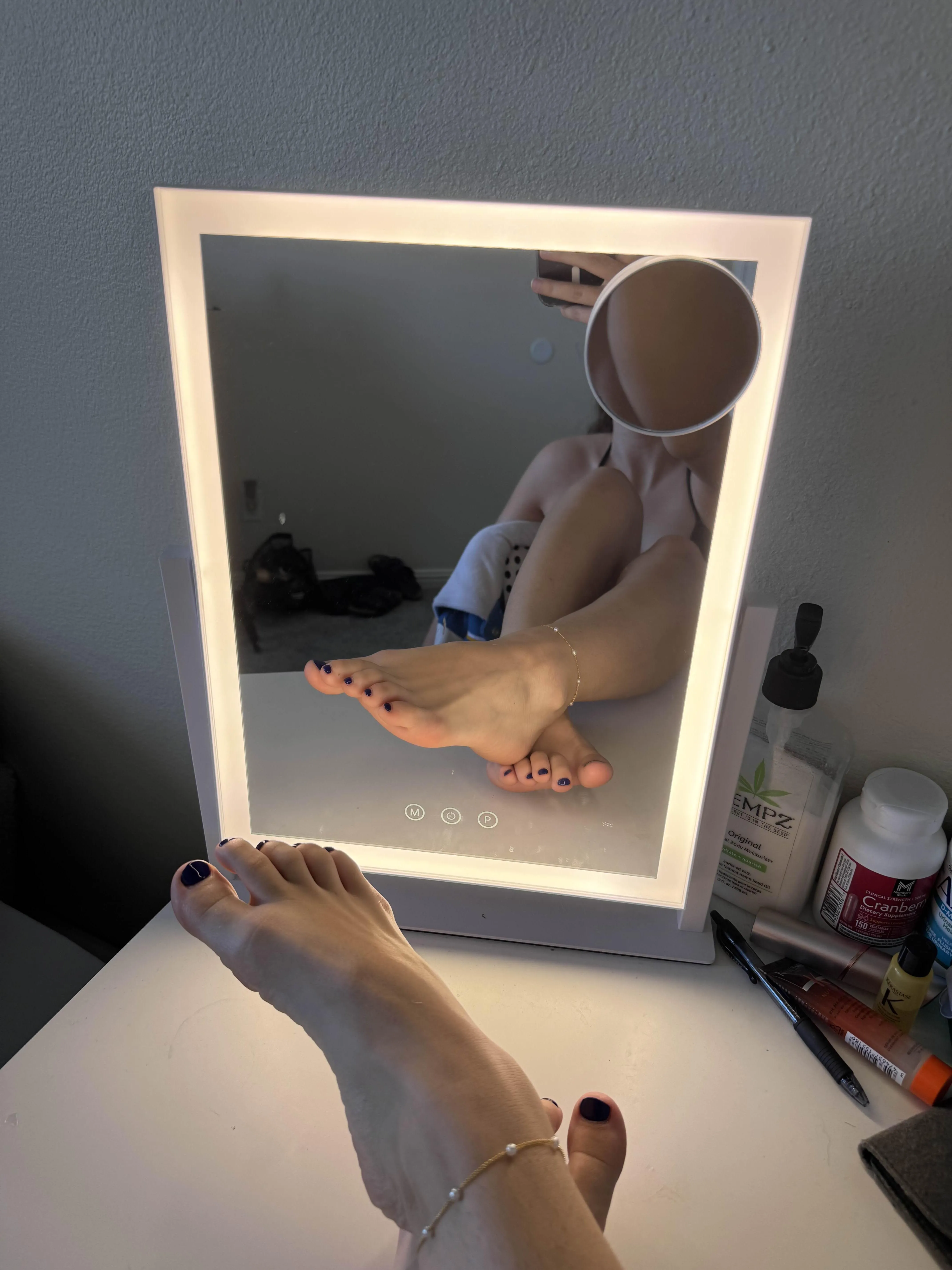 Just in a bikini taking pictures of my feet in a mirror. Why?