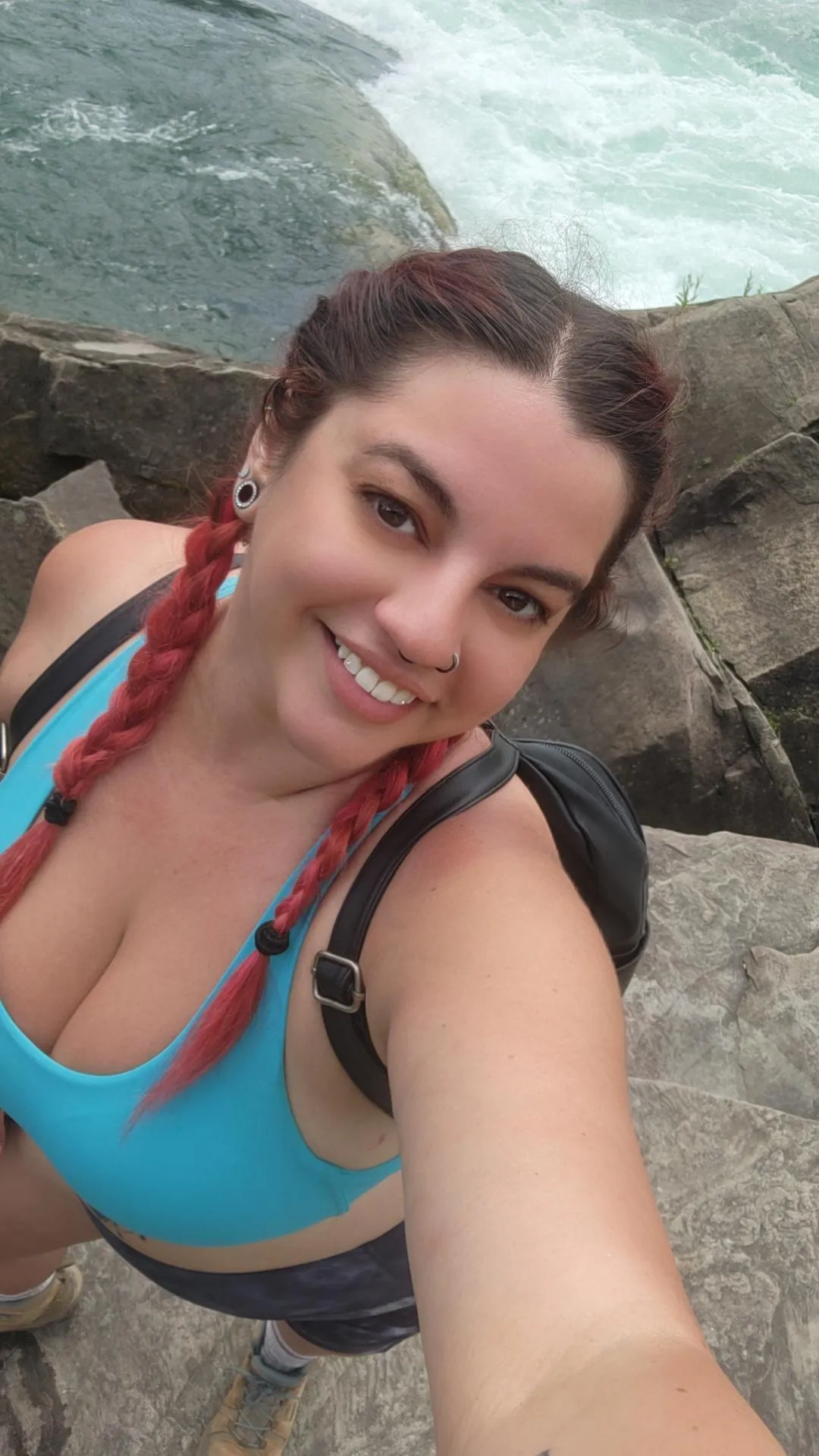 Standing at the edge of adventure, with the rush of the rapids behind me and a smile that's just as wild