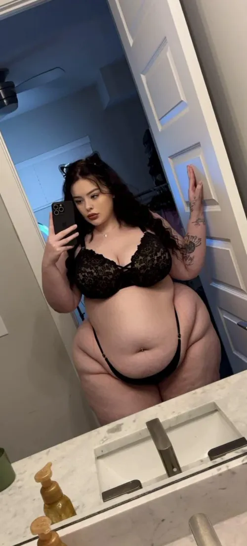 thick curves on full display in black lingerie