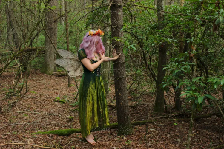 Fae tempts you to enter the forest by exposing her breasts