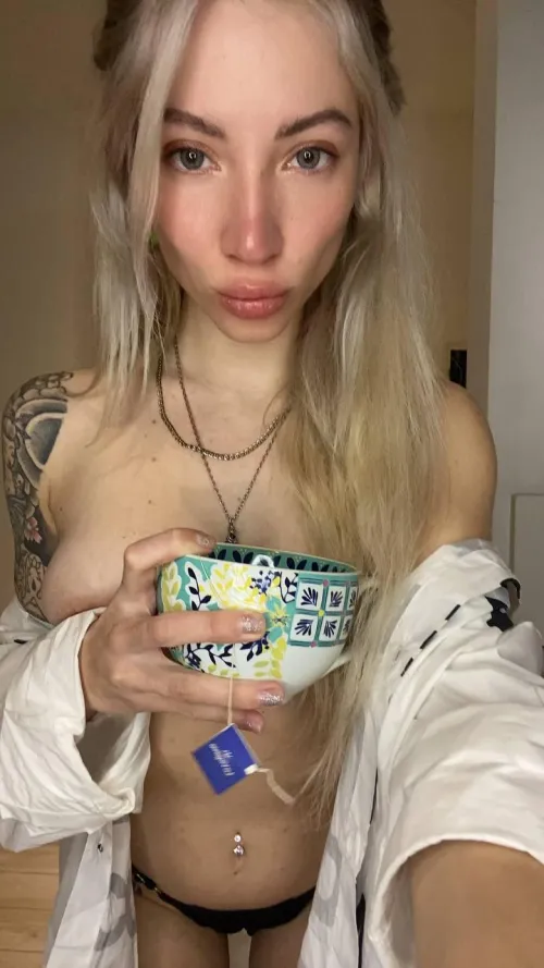 Serving drinks, stealing hearts, and spilling out of this bikini.