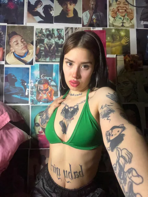 Tiny curves, tattooed skin, and eyes that beg for more.