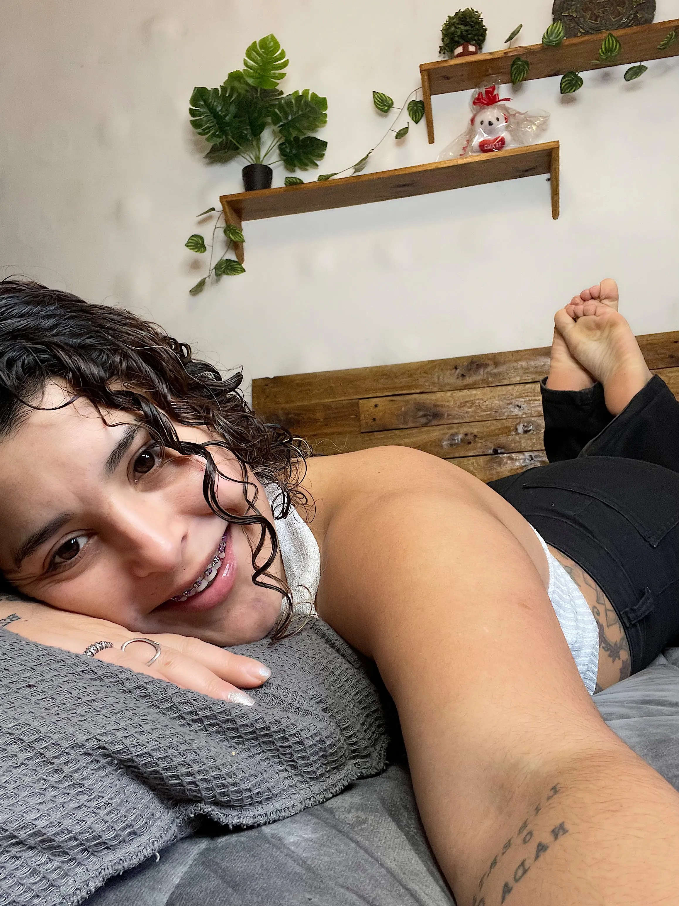 A normal girl, with an ego from bathing, showing off her pink braces