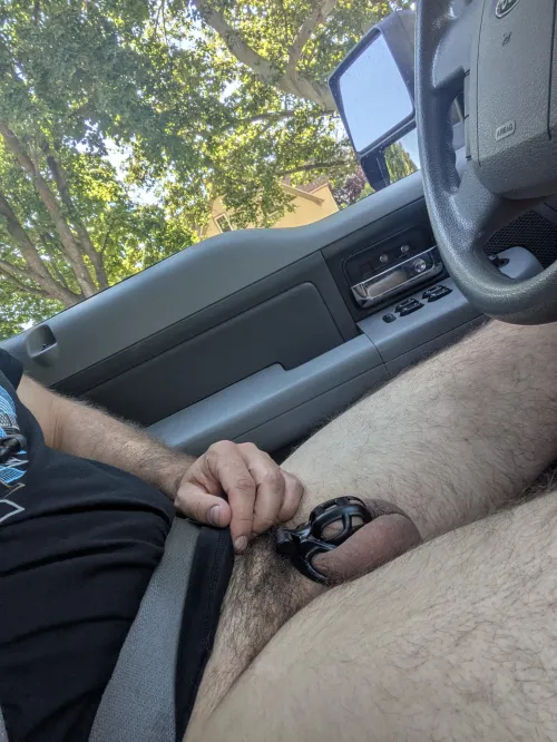 Driving with my locked cock out just feels better than driving any other way