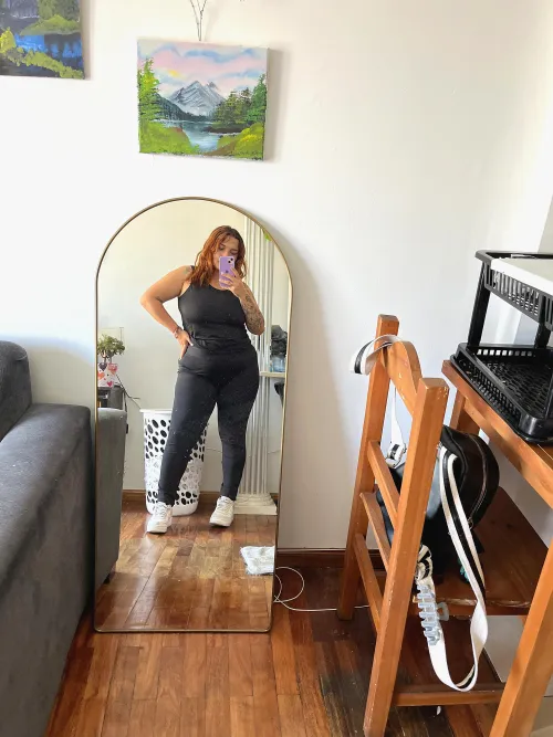 Curves, curls, and confidence all wrapped up in my favorite black leggings.