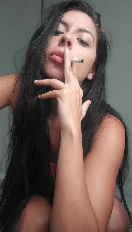 My lips exhale smoke