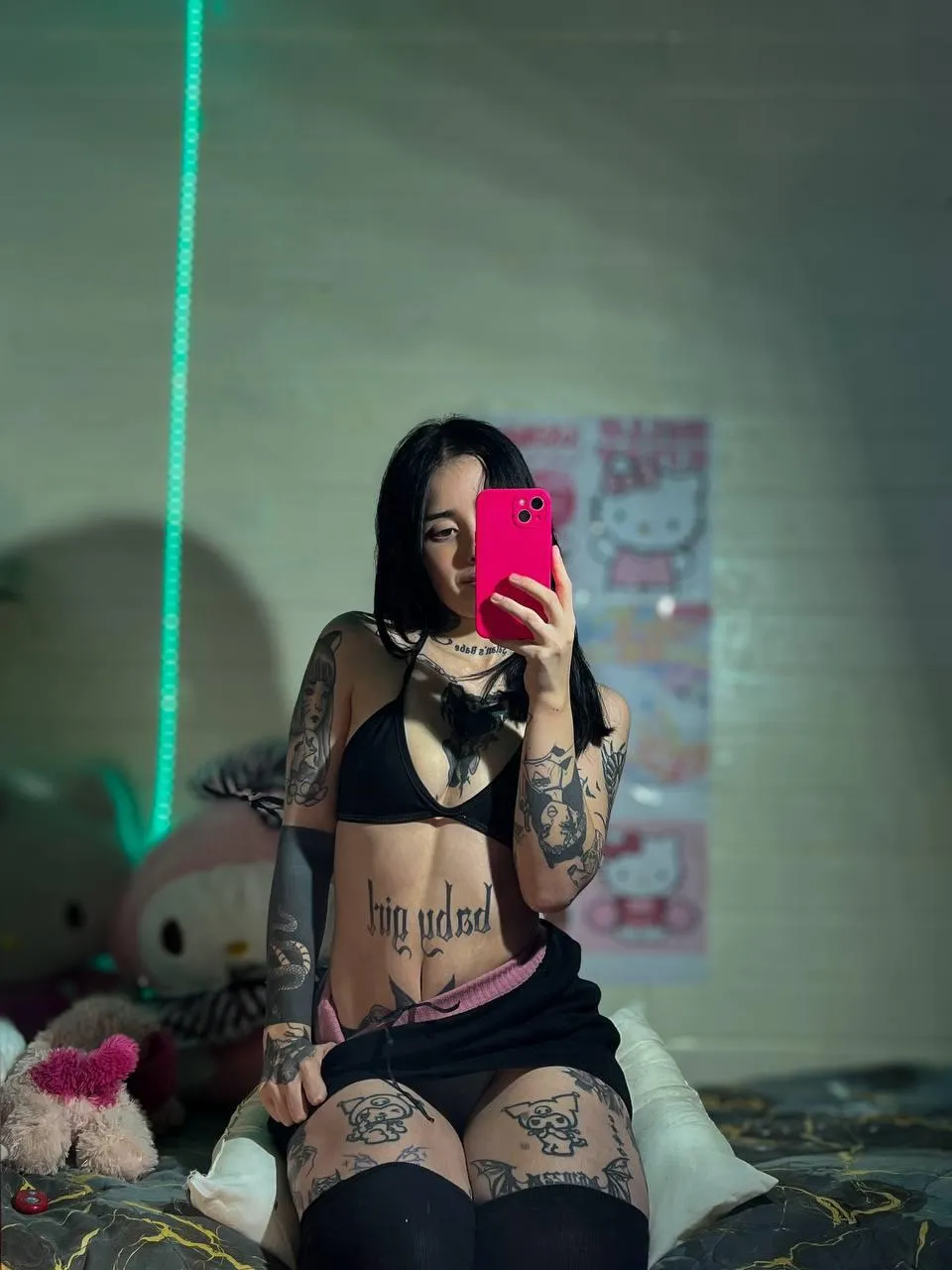 Soft curves, sharp nails, and tattoos begging to be explored.