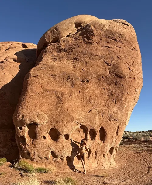 Tan skin on red rocks