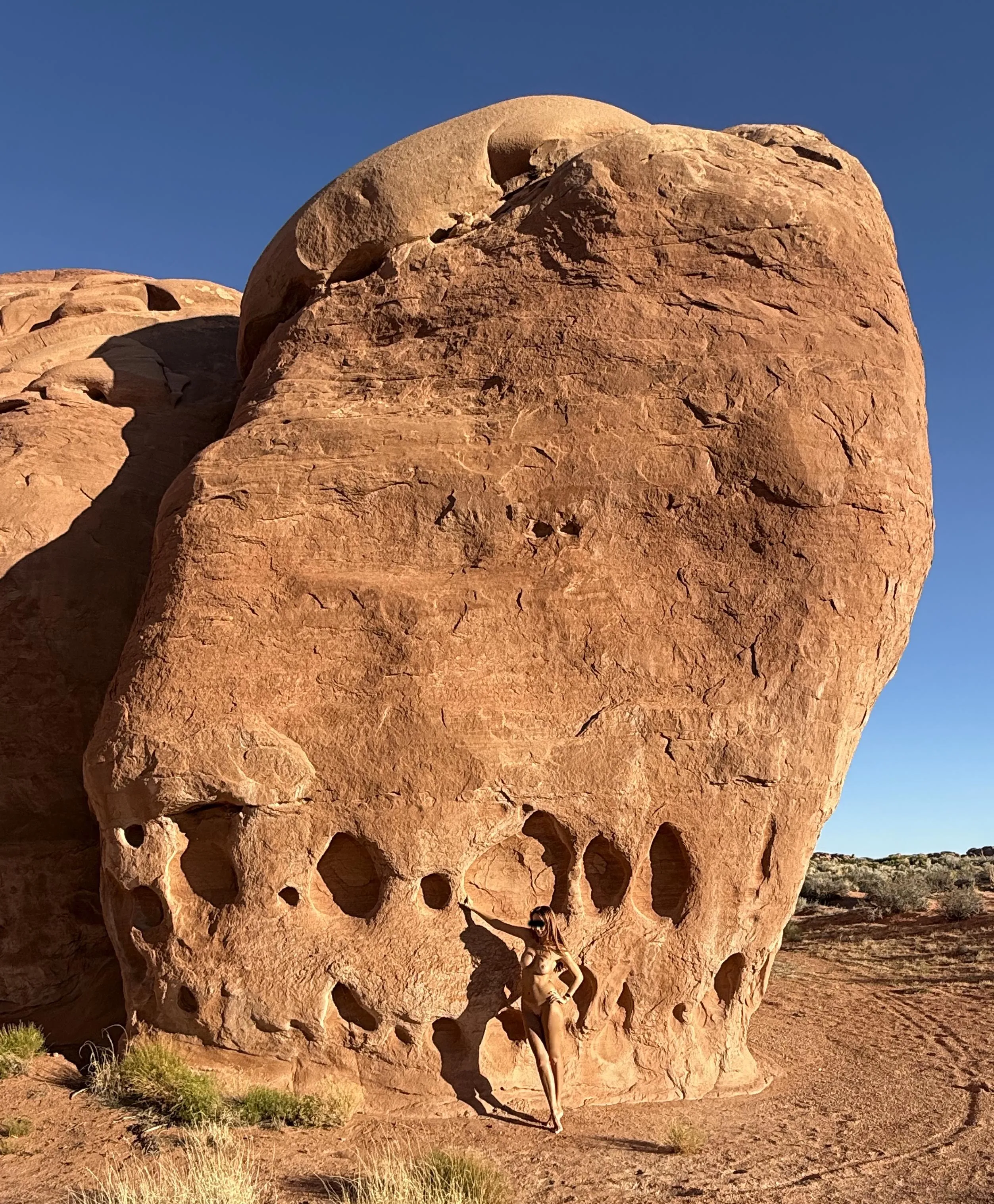 Tan skin on red rocks