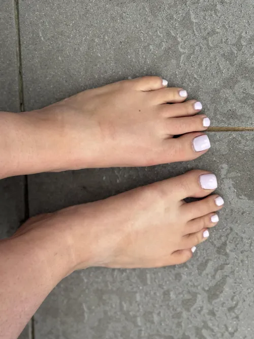 Barefoot on the wet terrace… they’re soft, sweaty, and you can guess the rest