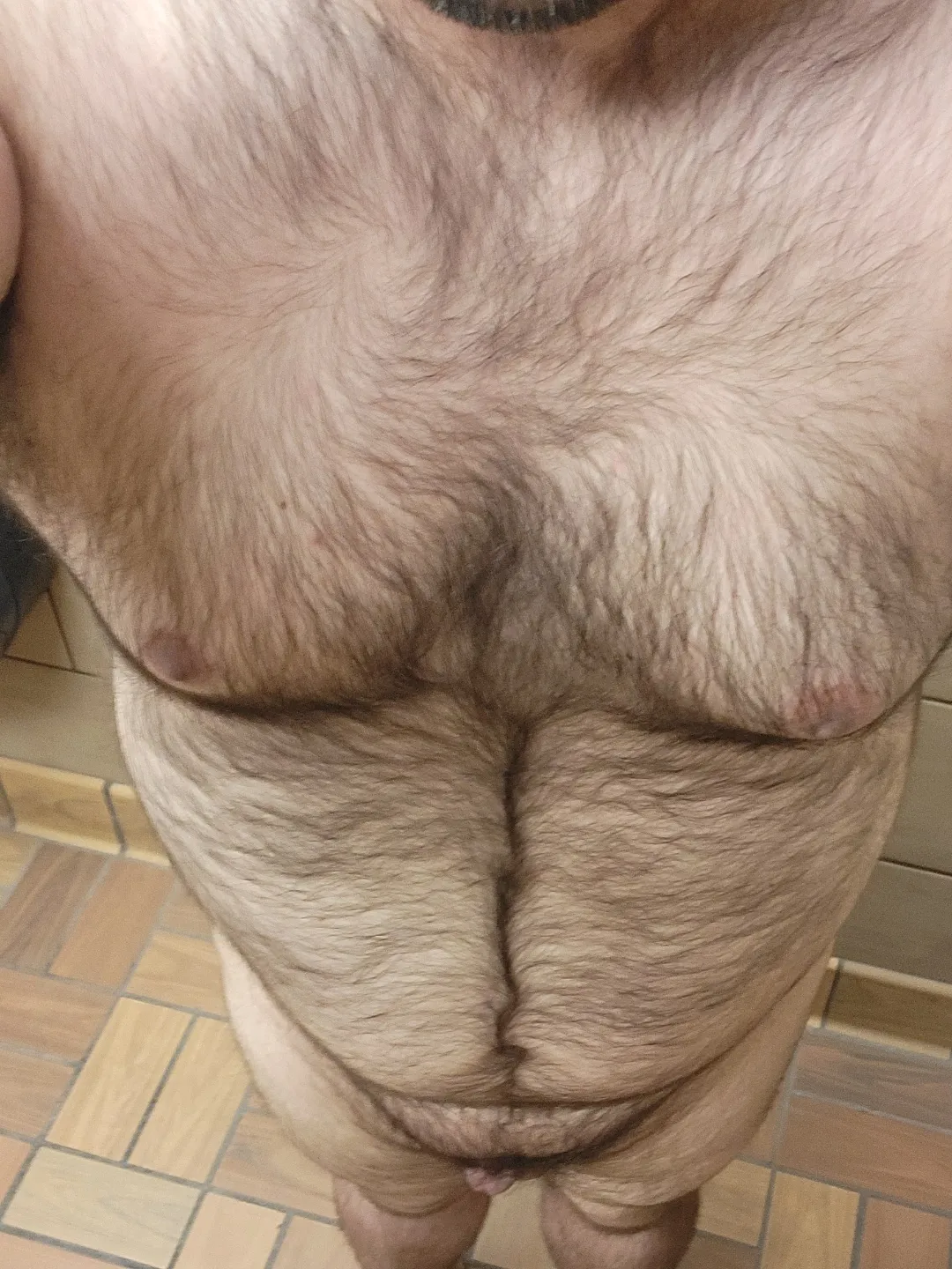 Naked in a gas station bathroom stall