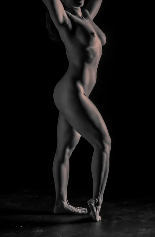 She stood like a flame in the dark — fierce, fluid, and untouchable.