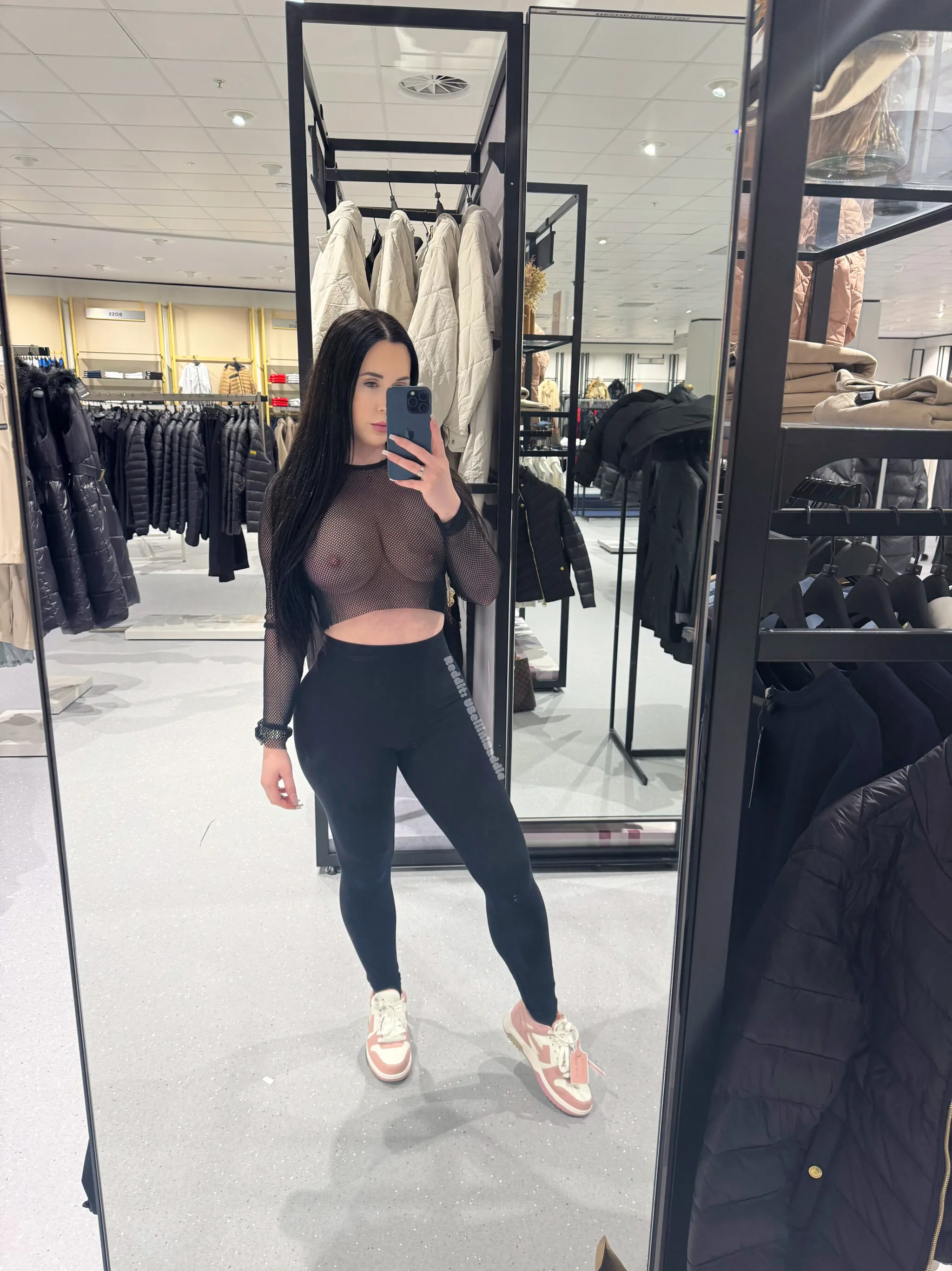 Shopping braless in a sheer top