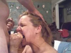 Tough mature woman bites down hard on man's cock.