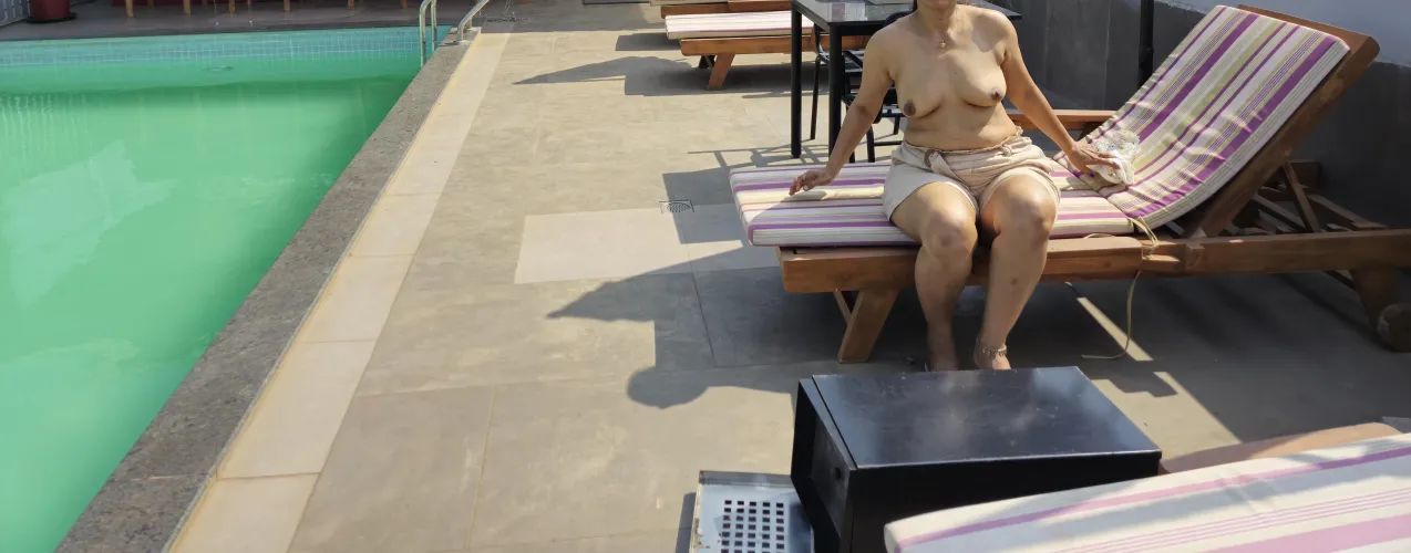 Wife topless Poolside
