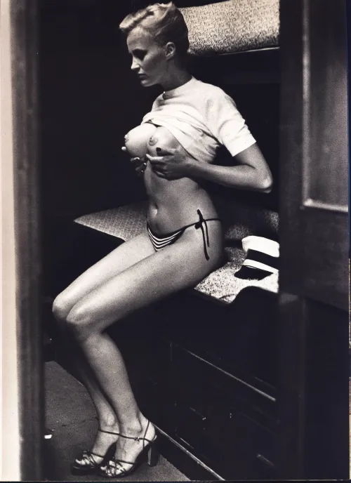Danish model Winnie Holman with prosthetic breasts for a photoshoot in Cannes by Helmut Newton in 1975