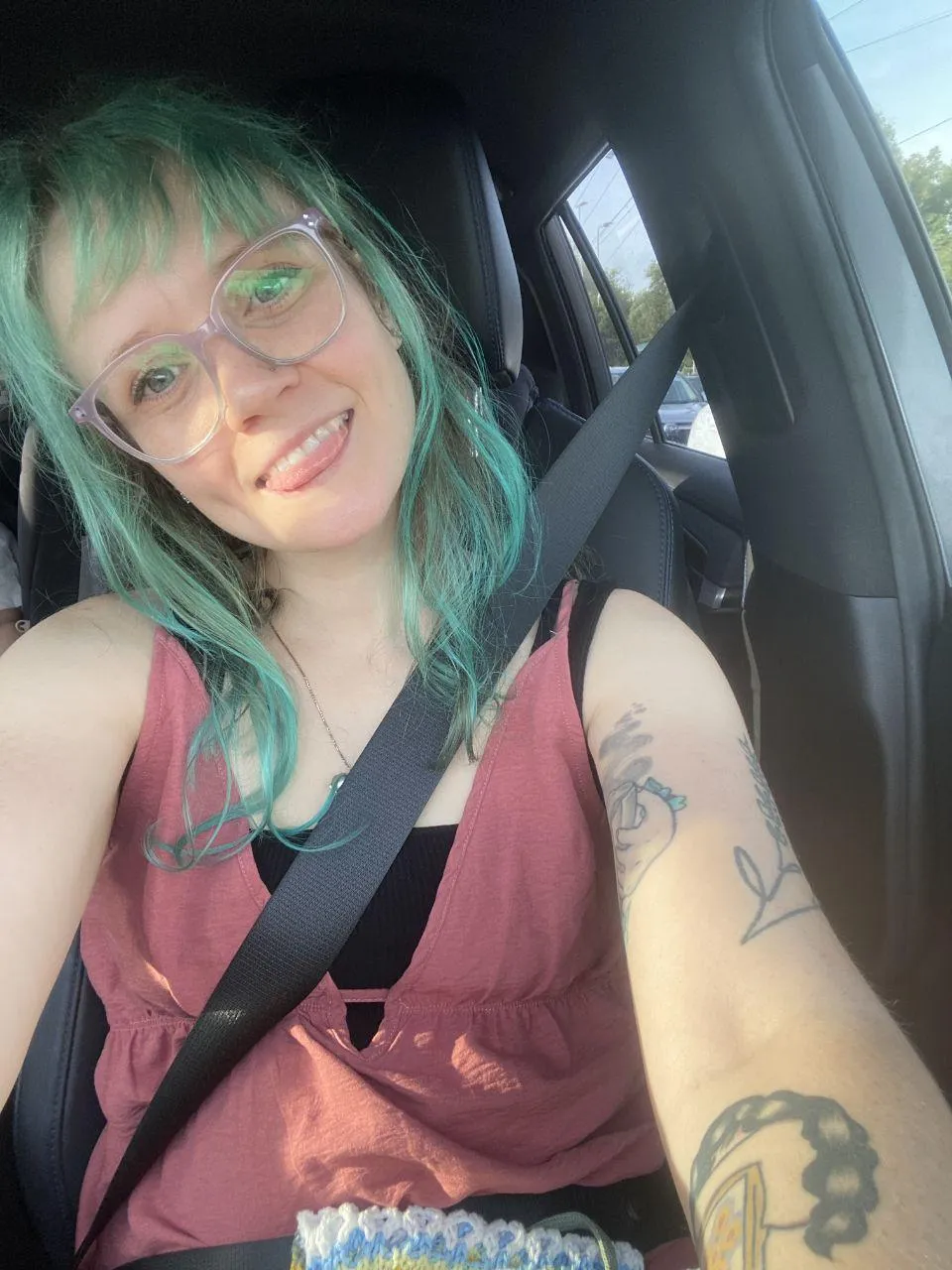 green hair, tongue out, seatbelt tight. let's see how long you last in the passenger seat