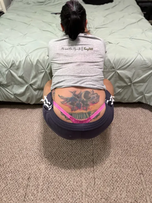 The Leopard finally has down time. She takes comfort in the color pink while reading DMs.